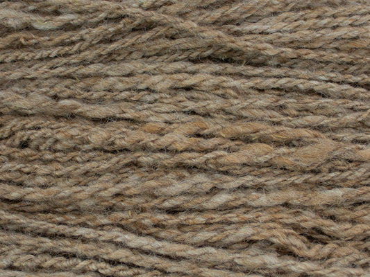 Strands of Burl, a bulky and fawn colored yarn produced by Gothfarm Yarn and made from Shetland wool and alpaca fleece.